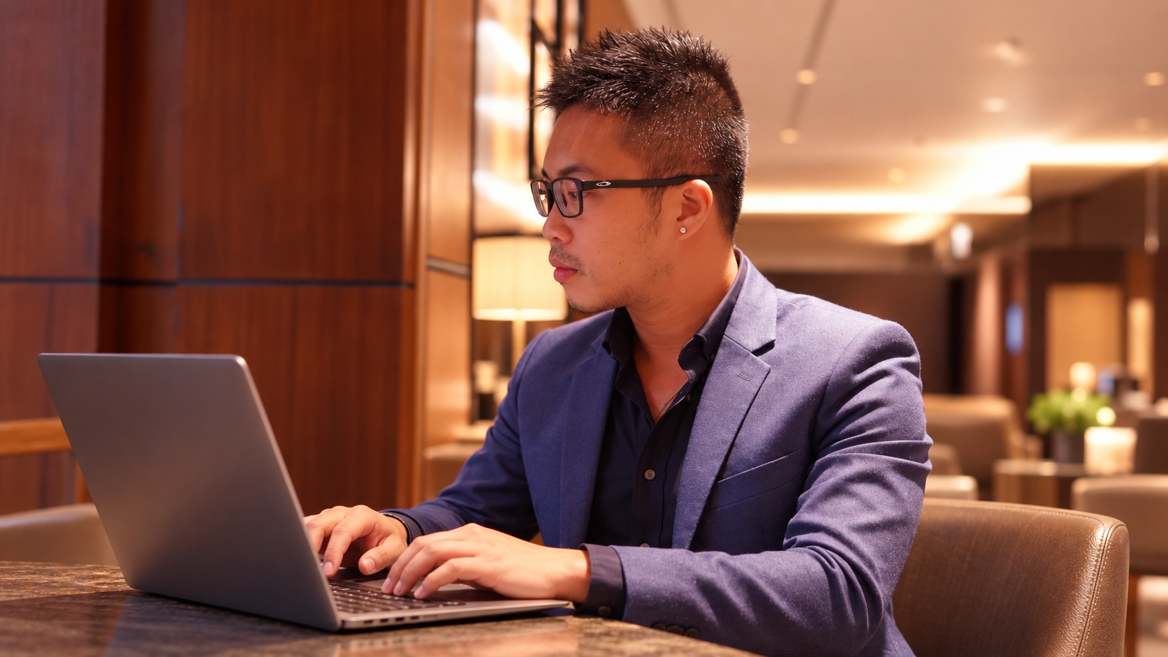 Kelvin Ang working on laptop